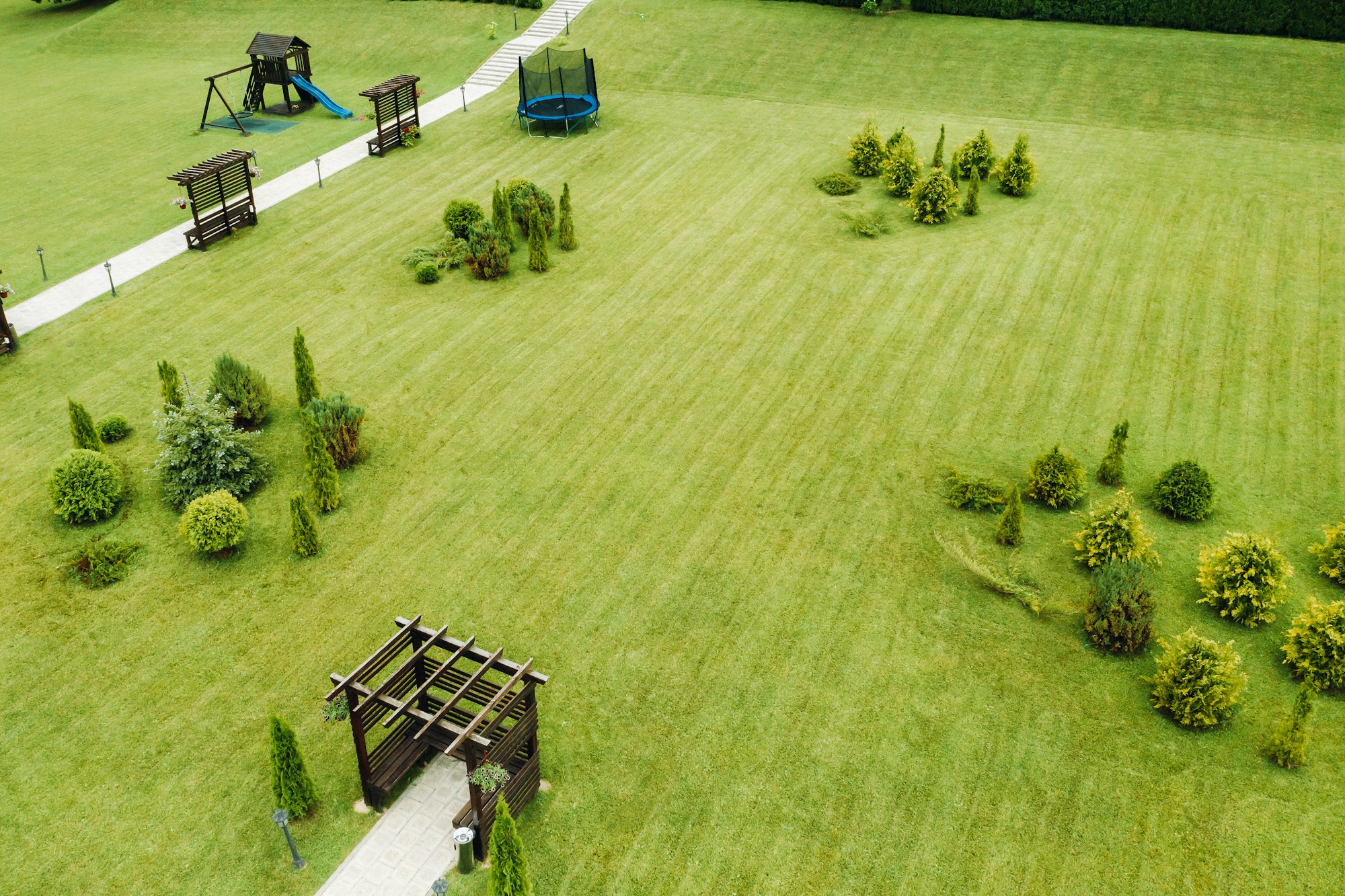 top view of a green lawn with Seating areas and a garden.Landscape area of the site